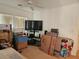 A cluttered bedroom area, lit by natural light, is waiting to be moved into at 1169 Paradise River Rd, Henderson, NV 89002