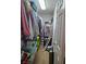 Walk-in closet with plenty of storage space for clothes, luggage, and accessories at 1169 Paradise River Rd, Henderson, NV 89002