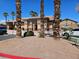 Community center showcasing desert landscaping with palm trees and well-maintained architecture at 1169 Paradise River Rd, Henderson, NV 89002