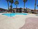 A community pool surrounded by lush landscaping offering a refreshing escape for residents at 1169 Paradise River Rd, Henderson, NV 89002