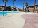 A community pool surrounded by lush landscaping offering a refreshing escape for residents at 1169 Paradise River Rd, Henderson, NV 89002