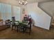 Cozy dining room with modern chandelier lighting with view of stairs at 1169 Paradise River Rd, Henderson, NV 89002