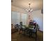 Cozy dining room features modern chandelier lighting with views to backyard at 1169 Paradise River Rd, Henderson, NV 89002