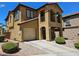 Charming two-story home with arched entryway, balcony, and attached one car garage at 1169 Paradise River Rd, Henderson, NV 89002