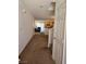Hallway leading to the kitchen/dining area with access to the stairway at 1169 Paradise River Rd, Henderson, NV 89002