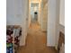Long hallway with multiple doors and closets shows flow through the residence at 1169 Paradise River Rd, Henderson, NV 89002
