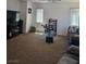 A well-lit living room showcases a ceiling fan and comfortable seating arrangement at 1169 Paradise River Rd, Henderson, NV 89002