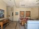 An inviting lobby area with comfortable seating and neutral decor, featuring tiled floors and ample natural light at 1169 Paradise River Rd, Henderson, NV 89002