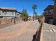 Scenic path with gravel and pavers lined with desert landscaping and views of charming homes at 1169 Paradise River Rd, Henderson, NV 89002