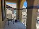 Inviting patio with textured walls and wrought iron railing offers a cozy outdoor retreat at 1169 Paradise River Rd, Henderson, NV 89002