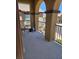 Comfortable patio features neutral colors and a wrought iron railing with a view of the surrounding landscape at 1169 Paradise River Rd, Henderson, NV 89002