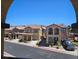 Charming stucco homes with tile roofs line a sunny street, showcasing a desirable neighborhood at 1169 Paradise River Rd, Henderson, NV 89002