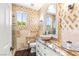 Tastefully remodeled bathroom with diamond pattern wall tile, vessel sink, and granite countertop at 11764 Golden Moments Ave, Las Vegas, NV 89138