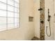 Walk in shower with pebble floor and rainfall shower head at 11764 Golden Moments Ave, Las Vegas, NV 89138