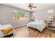 Bright bedroom with wood floors and large windows at 11764 Golden Moments Ave, Las Vegas, NV 89138