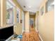 Hallway with wood floors, multiple windows and doors at 11764 Golden Moments Ave, Las Vegas, NV 89138