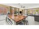 Spacious kitchen features a large island, stone accent wall and stainless steel sink at 11764 Golden Moments Ave, Las Vegas, NV 89138