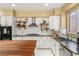 Well-appointed kitchen with a breakfast bar, stainless steel appliances, and a cozy breakfast nook at 11764 Golden Moments Ave, Las Vegas, NV 89138