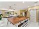 Open-concept living area with a kitchen island and a sliding barn door at 11764 Golden Moments Ave, Las Vegas, NV 89138