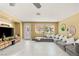 Bright and spacious living room with large windows and plush, comfortable seating at 11764 Golden Moments Ave, Las Vegas, NV 89138