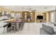 Open-concept layout features a kitchen island, living area, and large windows at 11764 Golden Moments Ave, Las Vegas, NV 89138