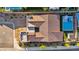 Aerial view of a home showcasing the tile roof, backyard pool, and surrounding landscape at 11954 Camden Ridge Ct, Las Vegas, NV 89138