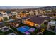 Aerial shot of backyard with outdoor kitchen, dining area, pool, spa and mountain view at 11954 Camden Ridge Ct, Las Vegas, NV 89138