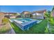 Beautiful backyard featuring a sparkling pool, spa, and lush turf, perfect for outdoor entertaining and relaxation at 11954 Camden Ridge Ct, Las Vegas, NV 89138