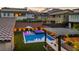 Backyard oasis with pool, hot tub, covered patio, BBQ, and mountain views at 11954 Camden Ridge Ct, Las Vegas, NV 89138