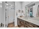 Bathroom features sleek vanity with modern hardware, a large mirror, and a shower area for convenience at 11954 Camden Ridge Ct, Las Vegas, NV 89138