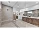 Modern bathroom featuring dual sink vanity, walk-in shower with glass door at 11954 Camden Ridge Ct, Las Vegas, NV 89138
