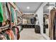 Walk-in closet with hanging clothes, shelving, and storage drawers for optimal organization at 11954 Camden Ridge Ct, Las Vegas, NV 89138