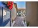 Inviting entryway leading to a charming patio with stylish seating and attractive landscaping at 11954 Camden Ridge Ct, Las Vegas, NV 89138