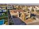 Aerial view of single story home with brick driveway, desert landscaping and mountains at 11954 Camden Ridge Ct, Las Vegas, NV 89138