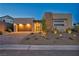 Modern single-Gathering house with a three car garage, attractive landscaping, and modern architectural design at 11954 Camden Ridge Ct, Las Vegas, NV 89138