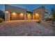 Modern home showcasing a driveway with a three car garage featuring stylish doors and beautiful stone accents at 11954 Camden Ridge Ct, Las Vegas, NV 89138