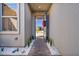 Inviting front entrance with a blue door, brick pathway, and decorative landscaping at 11954 Camden Ridge Ct, Las Vegas, NV 89138