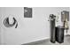 Garage wall shows electric car charger, electric panel, water conditioning equipment, and epoxy flooring at 11954 Camden Ridge Ct, Las Vegas, NV 89138