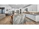 Bright, open kitchen with stainless appliances, large island with bar seating, and lots of storage at 11954 Camden Ridge Ct, Las Vegas, NV 89138