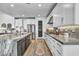 Gourmet kitchen with white cabinets, granite countertops, stainless steel appliances at 11954 Camden Ridge Ct, Las Vegas, NV 89138