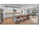 Modern kitchen with stainless appliances, oversized kitchen island, and barstool seating at 11954 Camden Ridge Ct, Las Vegas, NV 89138