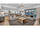 Open-concept living room and kitchen with hardwood floors and access to backyard at 11954 Camden Ridge Ct, Las Vegas, NV 89138