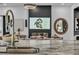 View of the living room fireplace from the kitchen island at 11954 Camden Ridge Ct, Las Vegas, NV 89138