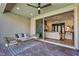 Covered patio featuring modern furniture, ceiling fan, and an open view to the adjacent living room at 11954 Camden Ridge Ct, Las Vegas, NV 89138