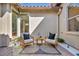 Cozy patio featuring stylish seating, a small table, and tasteful decor for a relaxing outdoor space at 11954 Camden Ridge Ct, Las Vegas, NV 89138