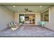 Covered patio with a cozy seating arrangement and direct access to the bright interior spaces at 11954 Camden Ridge Ct, Las Vegas, NV 89138