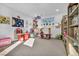 Bright and spacious playroom featuring play equipment, toy storage, and natural light at 11954 Camden Ridge Ct, Las Vegas, NV 89138
