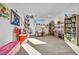 Spacious playroom with abundant natural light, built-in shelving, and a variety of toys and decor at 11954 Camden Ridge Ct, Las Vegas, NV 89138