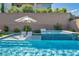 Beautiful pool with sun loungers and spa, perfect for relaxation and outdoor enjoyment at 11954 Camden Ridge Ct, Las Vegas, NV 89138