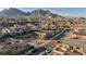Residential street view showcasing modern homes, landscaped yards, and mountain views at 11954 Camden Ridge Ct, Las Vegas, NV 89138